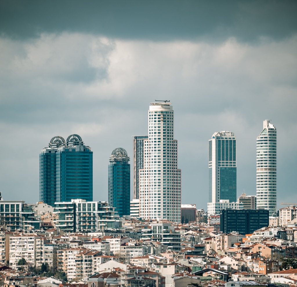 A view of modern skyscrapers towering above Istanbul's urban landscape, showcasing architectural contrast.